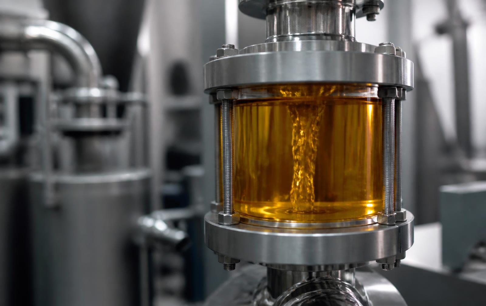 Clean transformer oil flowing through stainless steel processing equipment